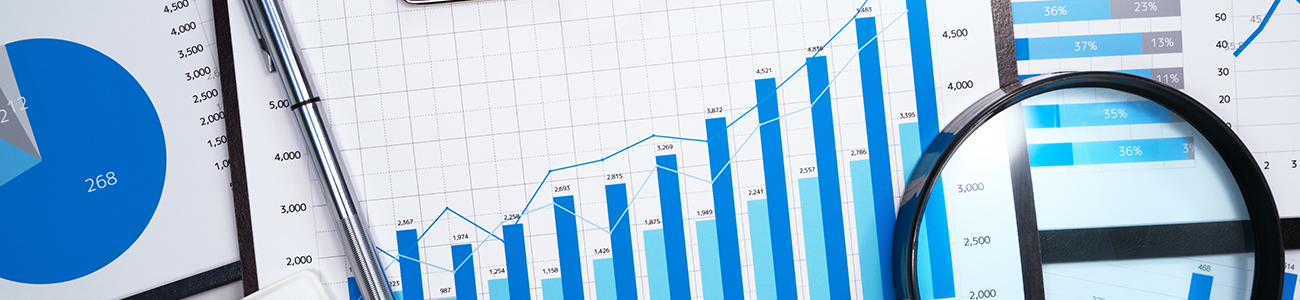 Data analysis. Developing business growth strategy. Many business reports. Magnifying glass,calculator and pen.