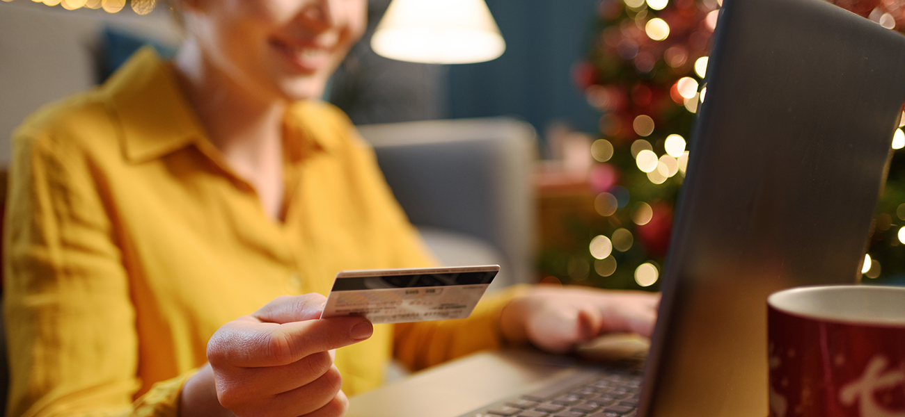 Happy woman doing online shopping at holiday time