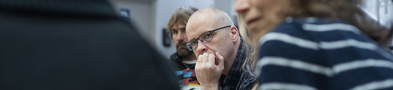 UBC staff member listening to presentation