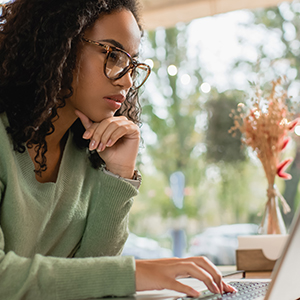 Staff worker at laptop wondering if they have fallen for a phish