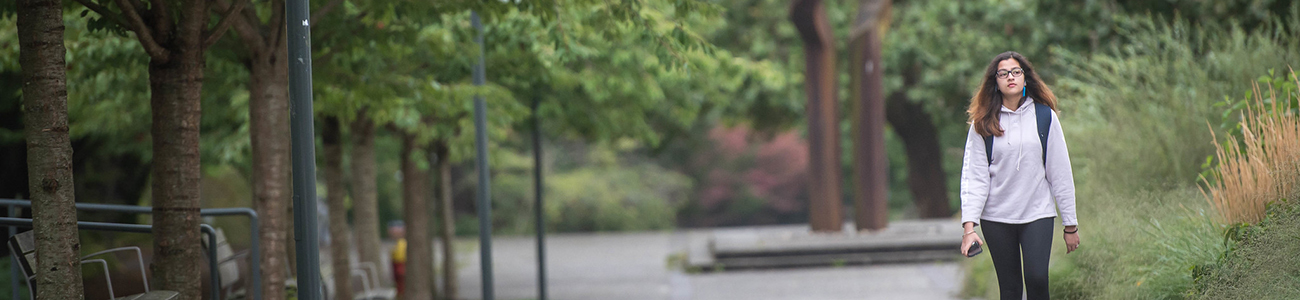 Student walks along Main Mall at UBC Vancouver